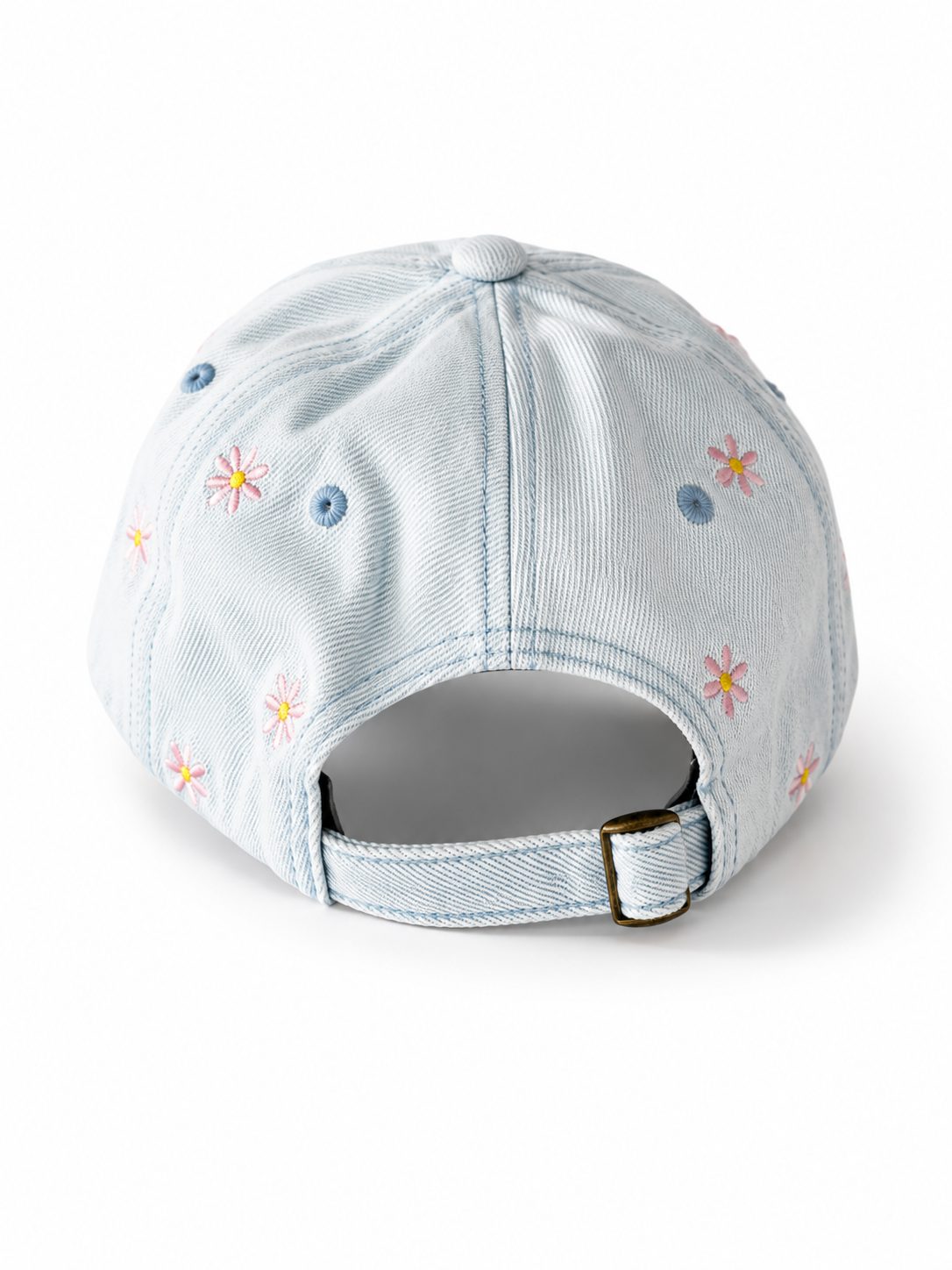 Light-wash denim baseball cap embroidered with pink and yellow flowers, front view on a white background.