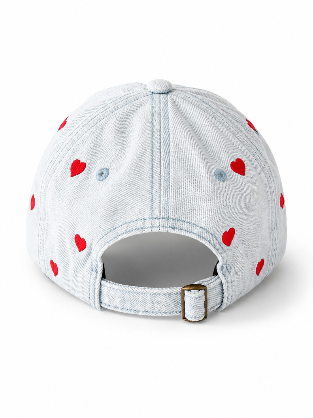Light-wash denim baseball cap embroidered with small red hearts, front view on a white background.