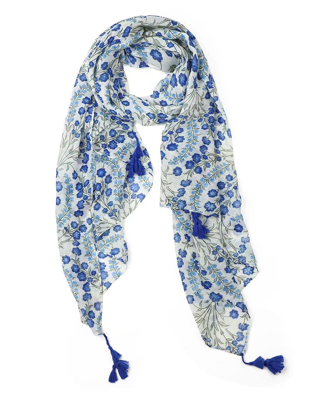 Blue floral field print lightweight scarf with sage green leaves and tassels