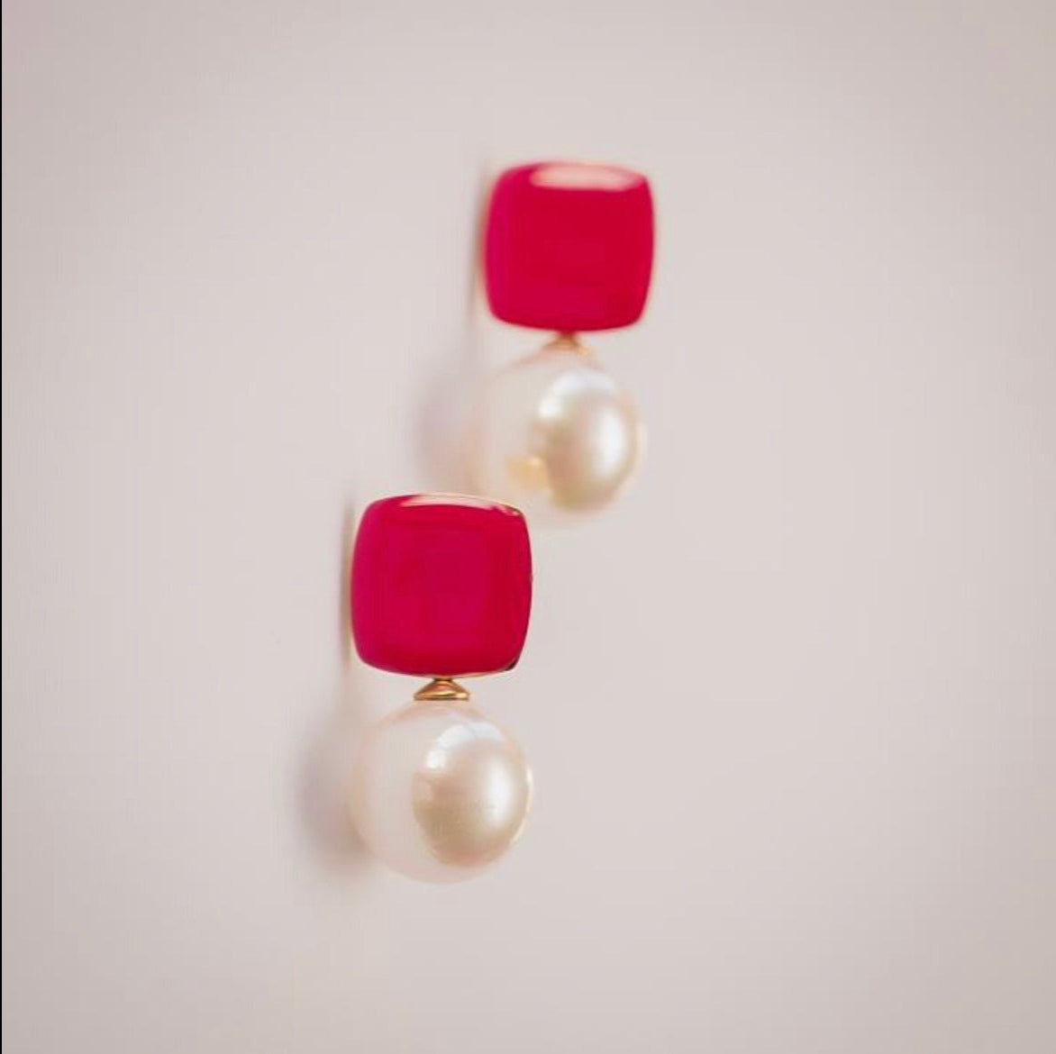 Felicity hot pink enamel square stud earrings with faux pearl drop by Greenwood Designs, shown on neutral background