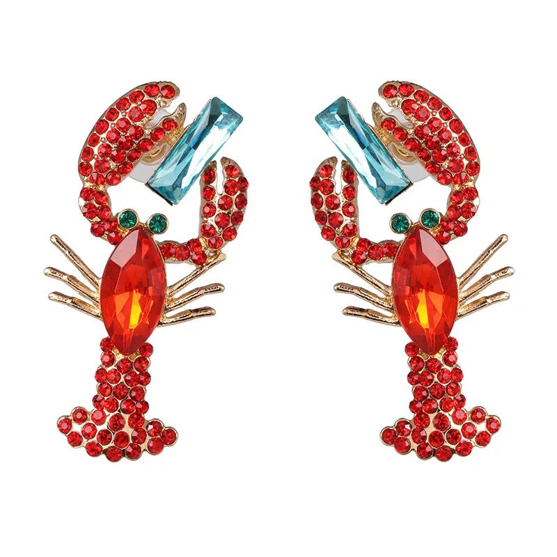 Bold, playful and full of sparkle—our red lobster diamanté earrings are the ultimate statement piece for parties, events or elevating your everyday look.