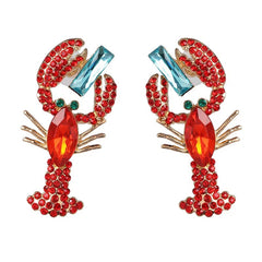 Bold, playful and full of sparkle—our red lobster diamanté earrings are the ultimate statement piece for parties, events or elevating your everyday look.