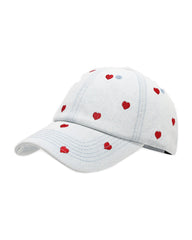 Light-wash denim baseball cap embroidered with small red hearts, front view on a white background.