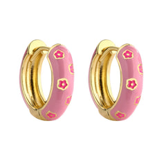 Light pink and gold enamel hoop earrings with pink flower pattern on white background