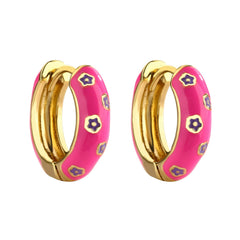 Pink and gold enamel hoop earrings with purple flower pattern on white background