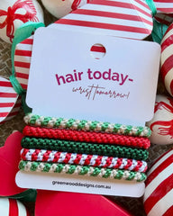 Jingle Belles Christmas hair elastics by Greenwood Designs, set of five colourful hair ties in red, green and gold, perfect for festive styling and Christmas gifts.