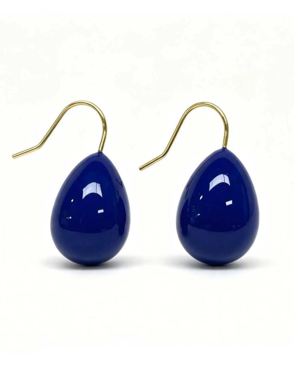 Gold drop earrings with a navy enamel teardrop design