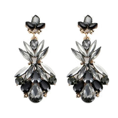 A pair of dangle earrings featuring black and grey crystals arranged in a chandelier style.