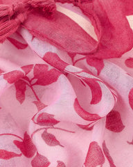 Strawberry pink, raspberry red, and cream leaf and spot print lightweight scarf with striped border