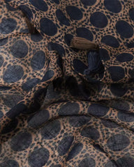 Tan animal print lightweight scarf with navy spots and tassels