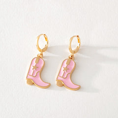 Pink enamel cowboy boot dangle earrings with gold hoop and star detail on white background