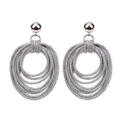 Lulu Lightweight Sparkly Silver Hoops on a Stud Earring