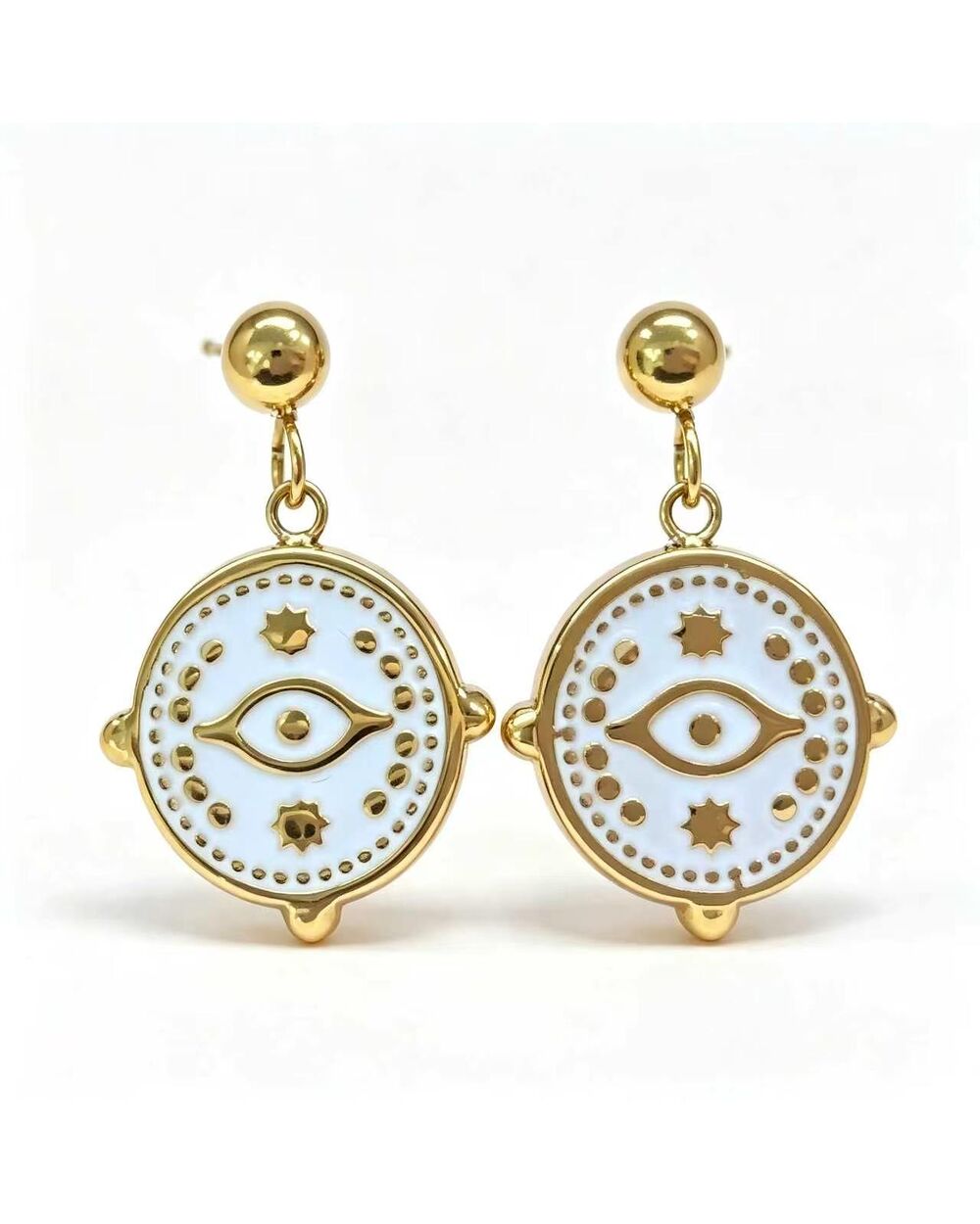Gold stud earrings with a white enamel evil eye charm dangle