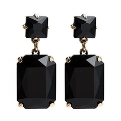 Pippa Black Rectangle Crystal Dangle Earrings featuring bold black gemstones in a gold-toned setting, dangling gracefully from surgical steel posts, 4.5x1.8cm.