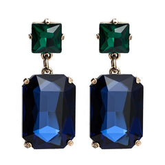 Pippa Emerald and Navy Rectangle Crystal Statement Dangle Earrings featuring an emerald green square crystal stud top and deep navy blue rectangle crystal drop in a gold-toned prong setting, 4.5x1.8cm.